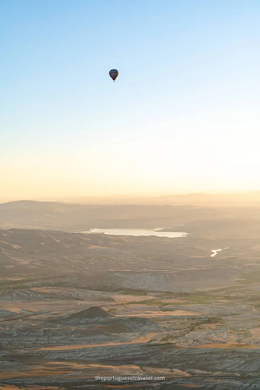 A single balloon in the distance, up high
