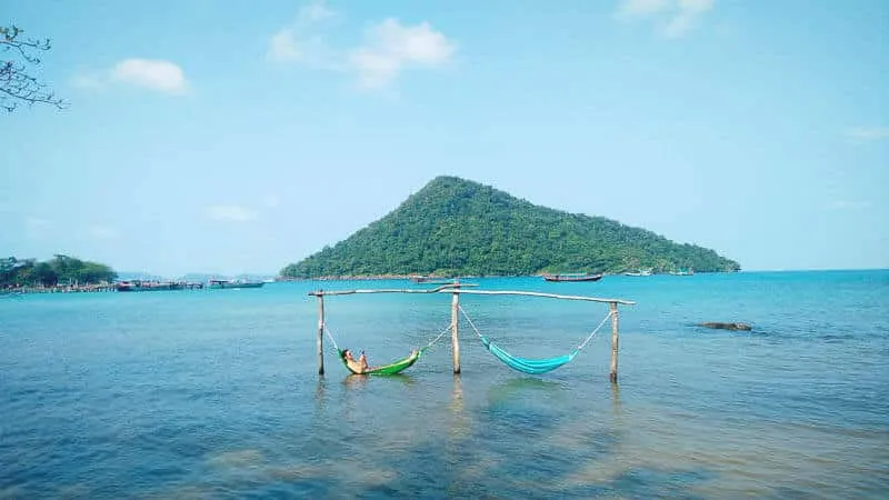 Reading  Hamocks on a beach in Koh Rong Samloem, Cambodia