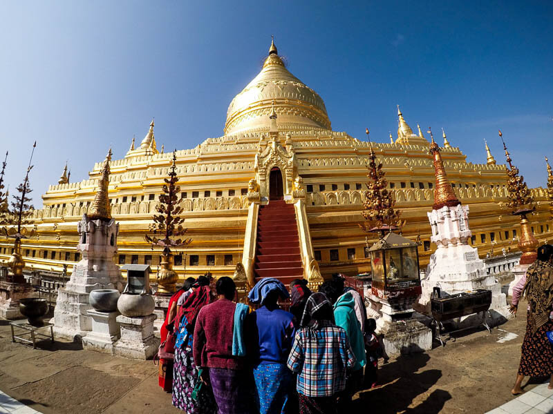 People praying at Golden Shwezigon Pagoda in Old Bagan, Myanmar