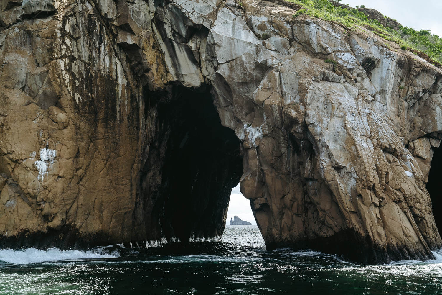 View to Kicker Rock from a hole in the Cerro Brujo