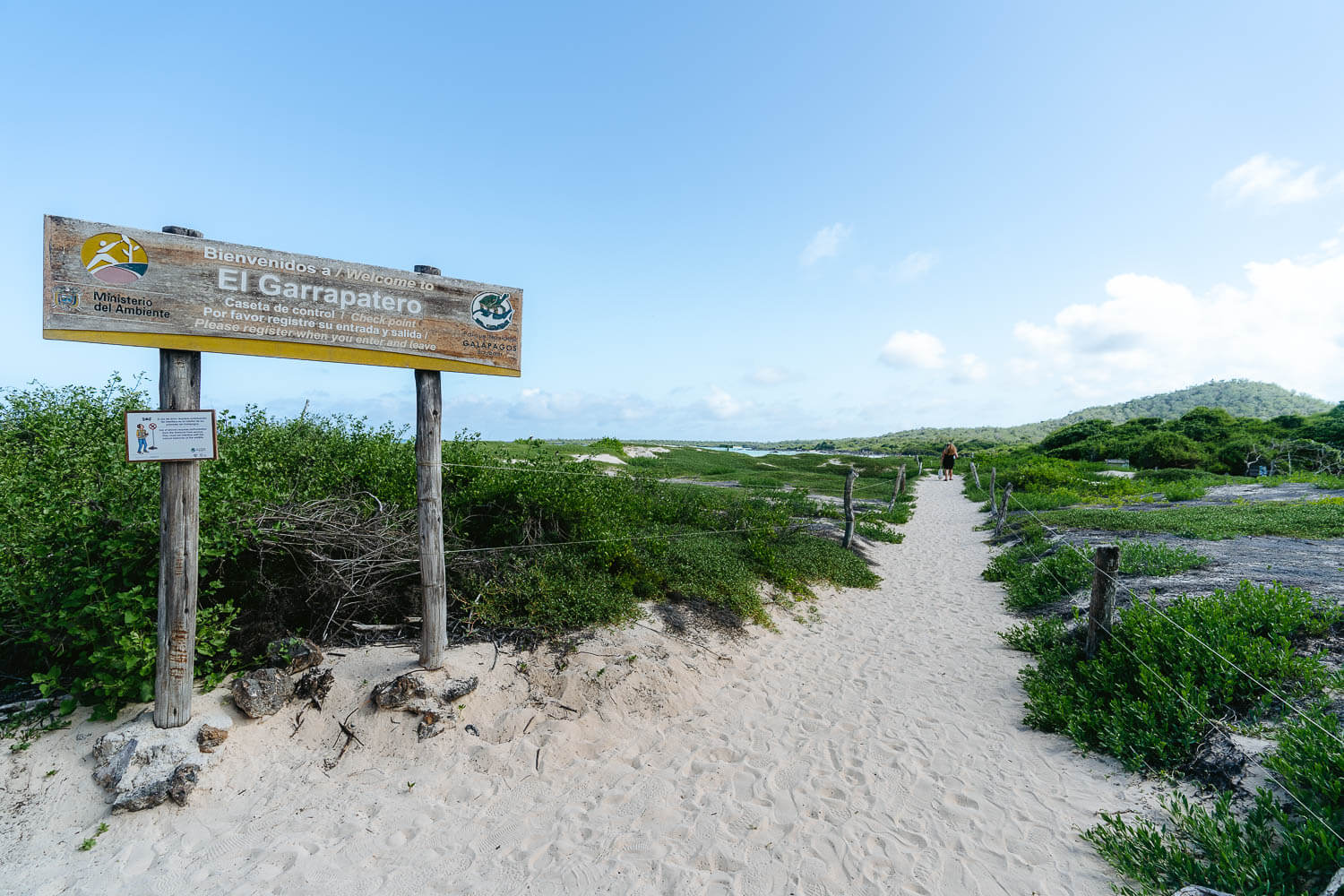 The wooden information board at the entrance of the beach