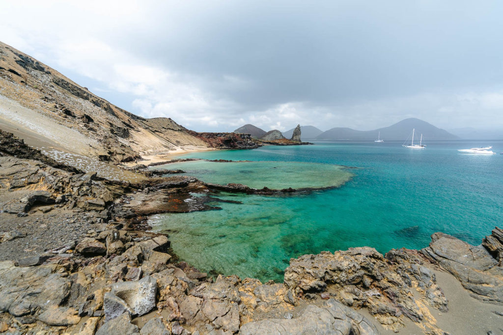 The pool, ships and Santiago island at the distance, a must in any Galapagos Itinerary