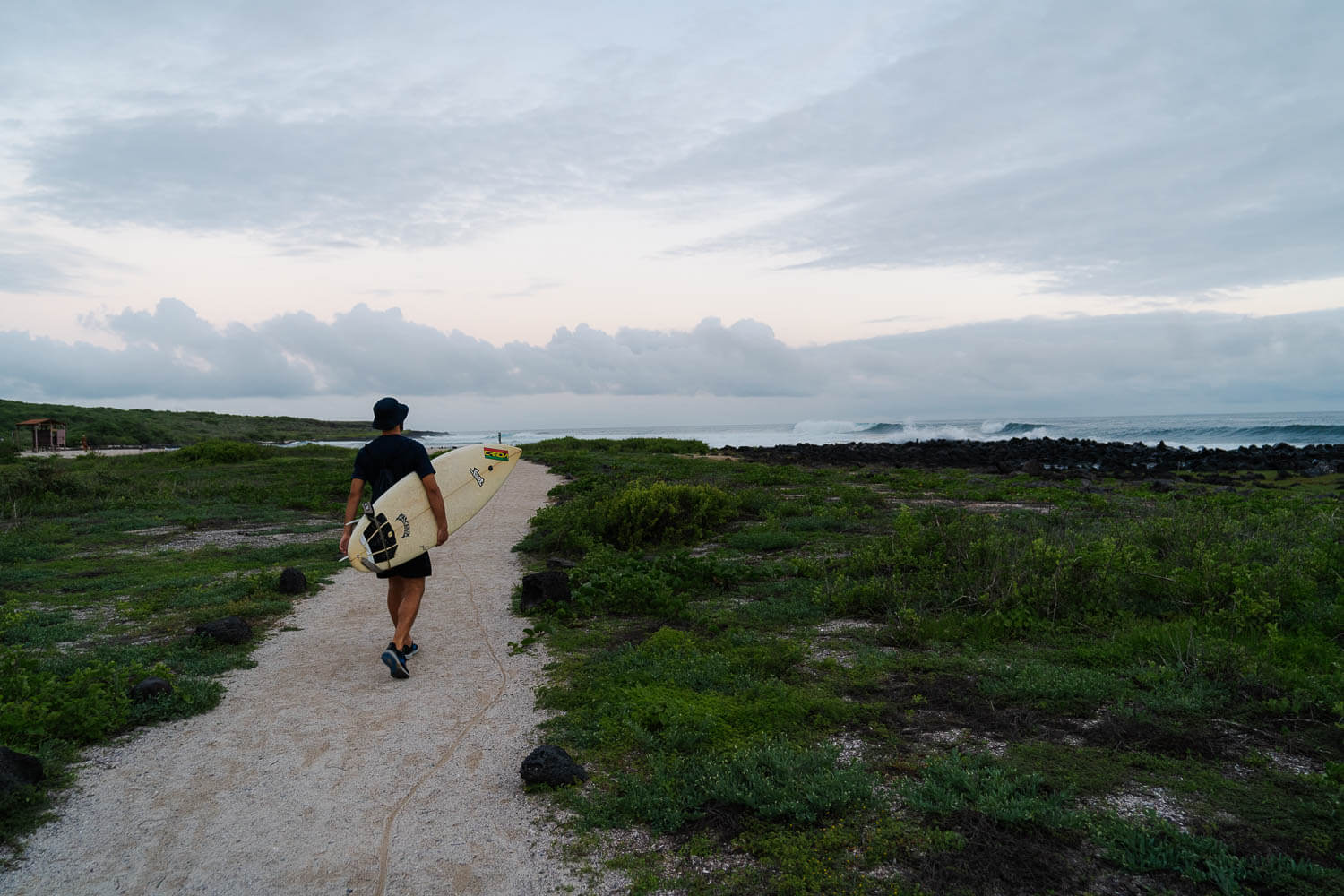 Surfer at the beach in San Cristobal