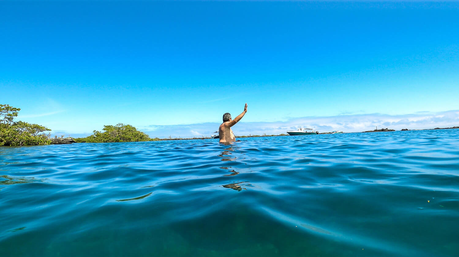 A man "flying" over the water