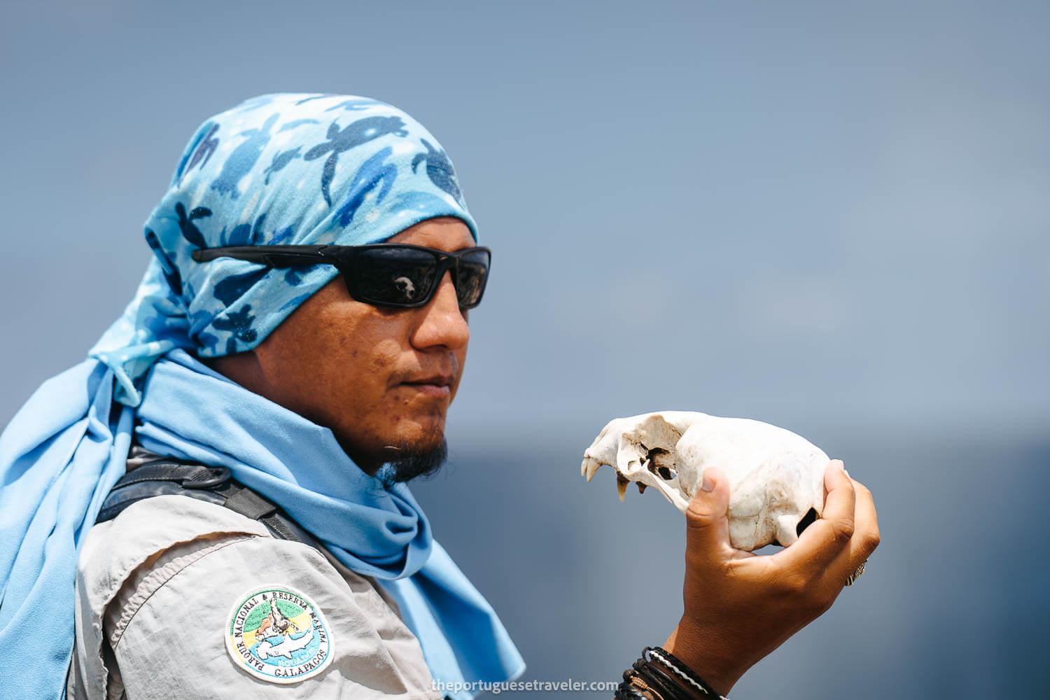 A sea lion skull and our guide on the Espanola Island Tour