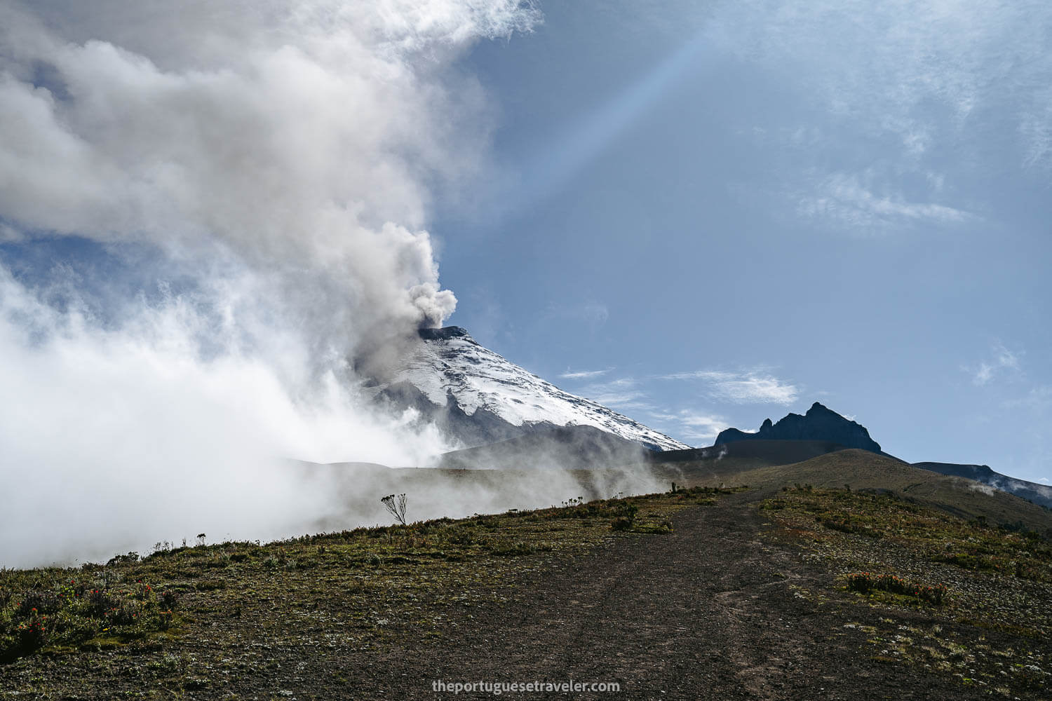Cotopaxi Volcano in eruption and Morurco at its right