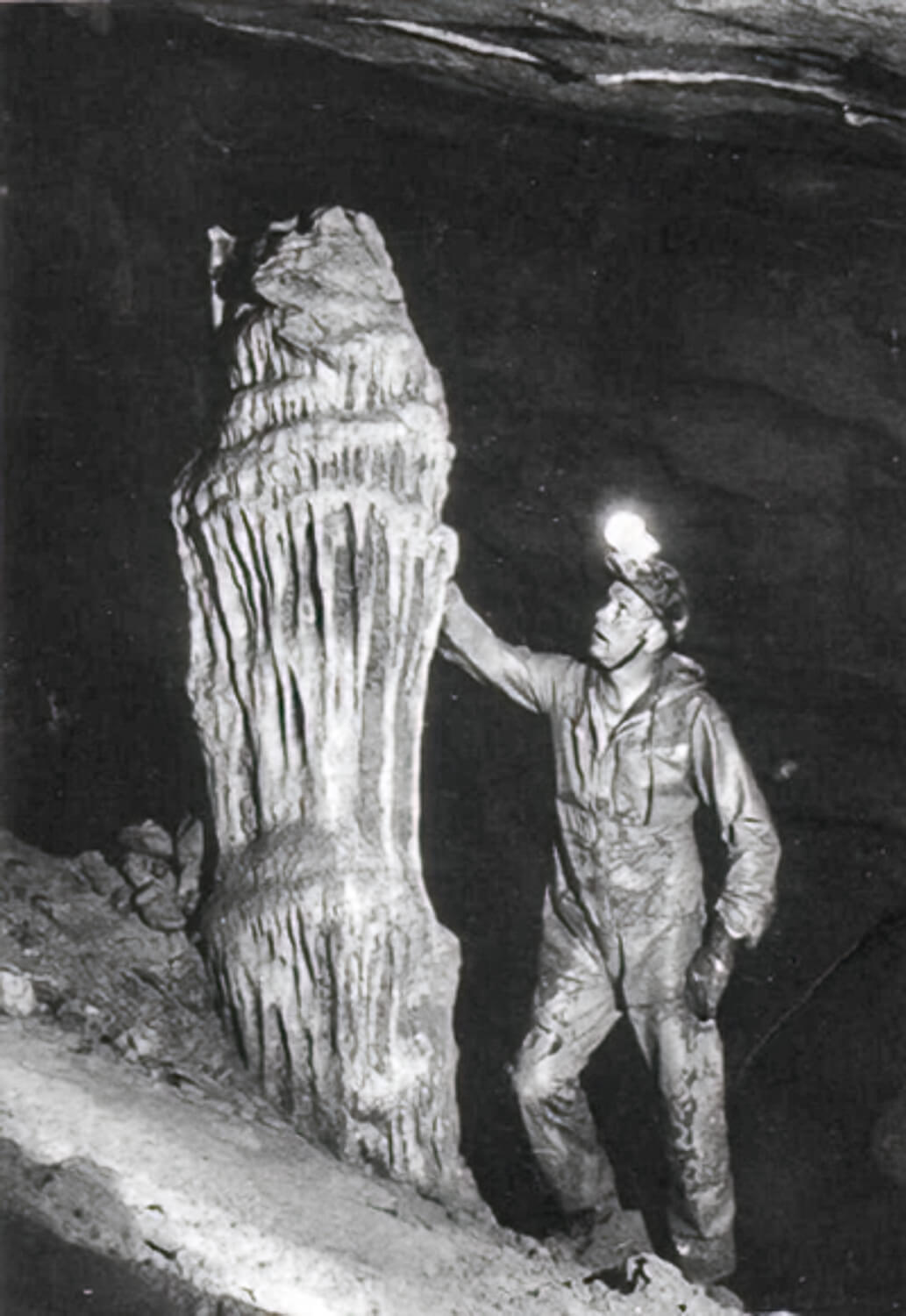 Neil Armstrong observing a huge stalagmite