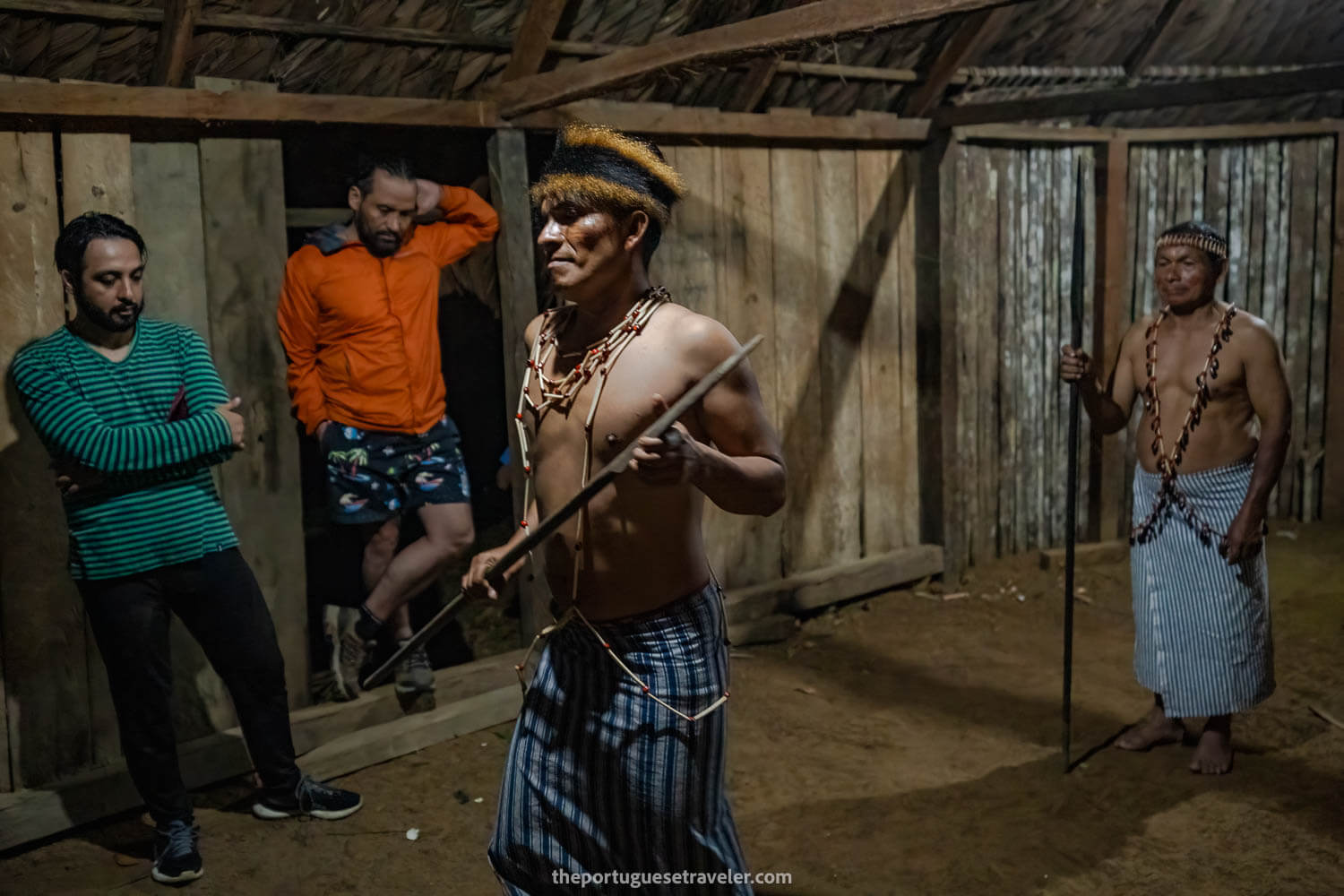 Jimmy and his father in full Shuar attire, dancing and speaking his language.