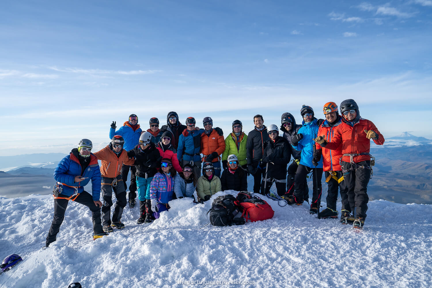 A group on top of Cayambe Volcano fully equipped. An Adventure Photographer guide.