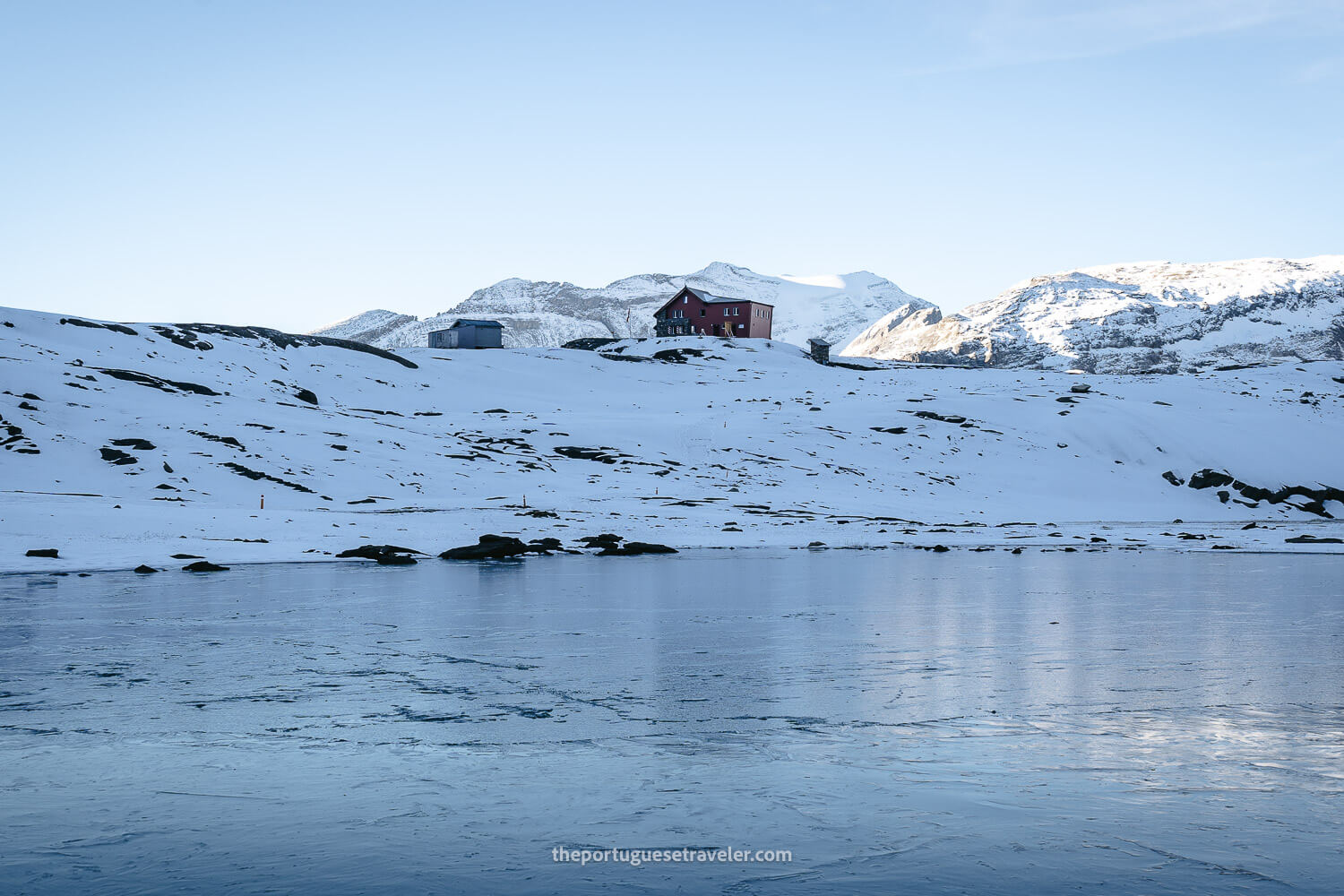 The Muttsee Hut over a frozen lake