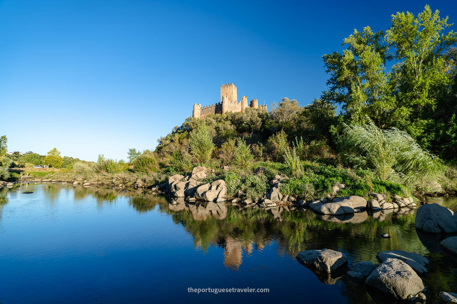 The beautiful reflections of the Almourol Castle on the Tagus River