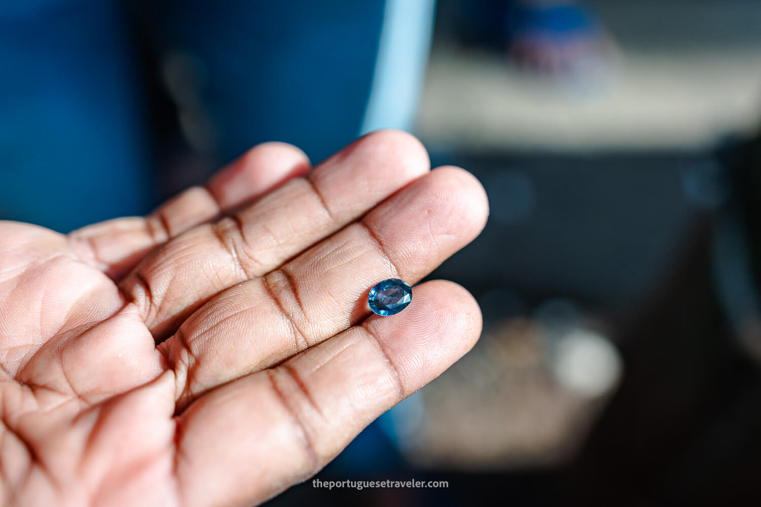 A gem vendor showing me supposedly a Sapphire