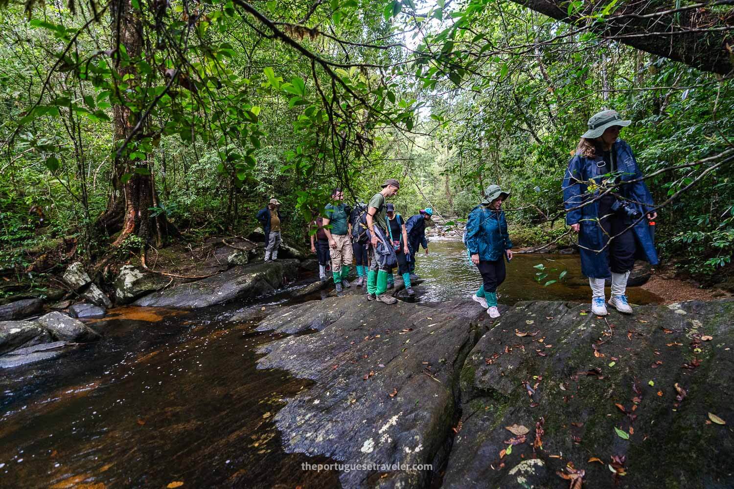 The group crossing a red river