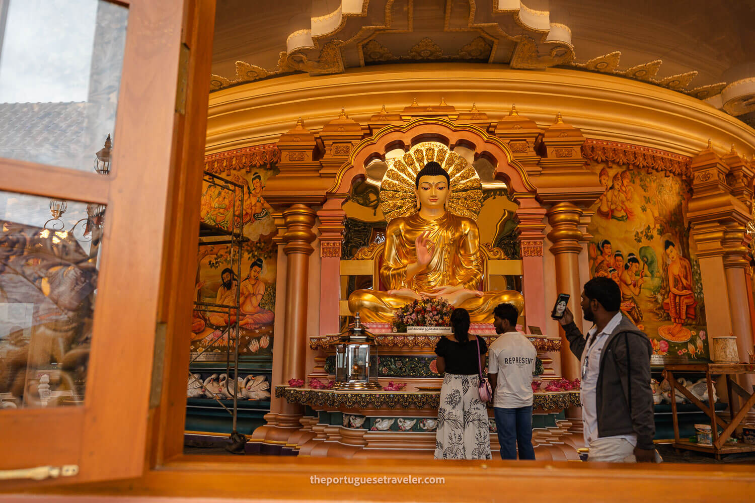 The Buddha's statue inside the temple seen from the exterior