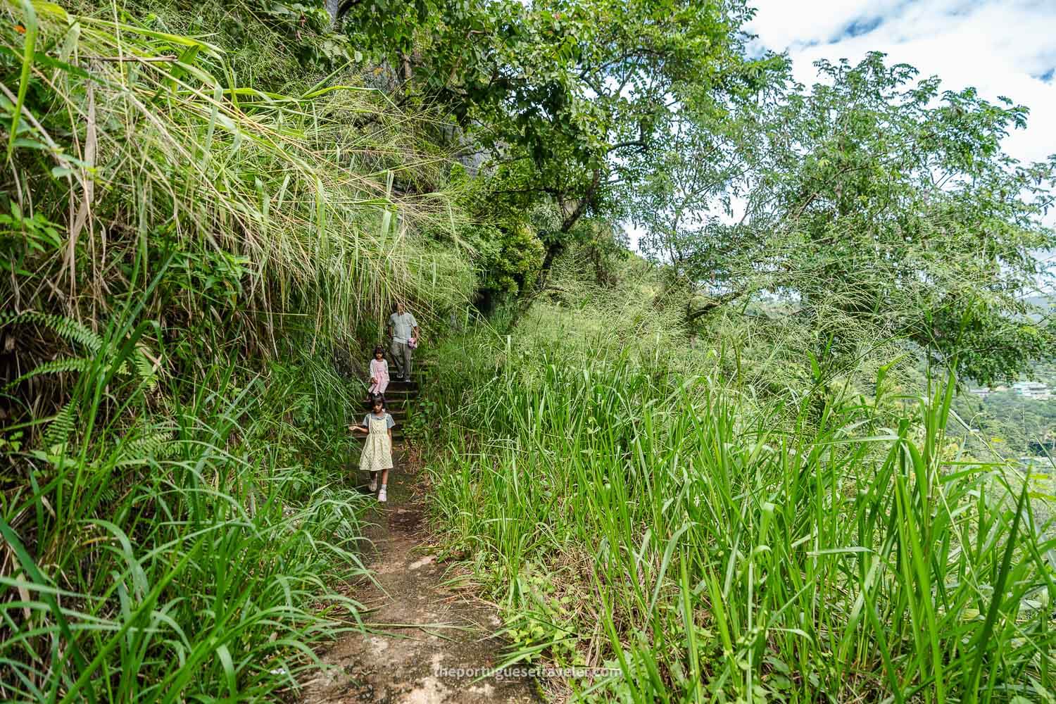 A family coming down from the cave