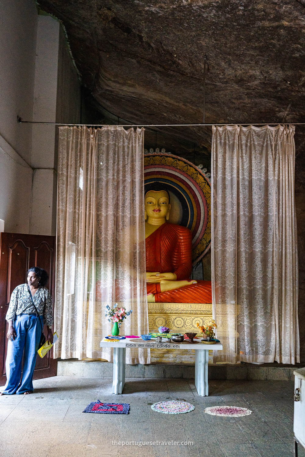 The seated Buddha statue inside the temple