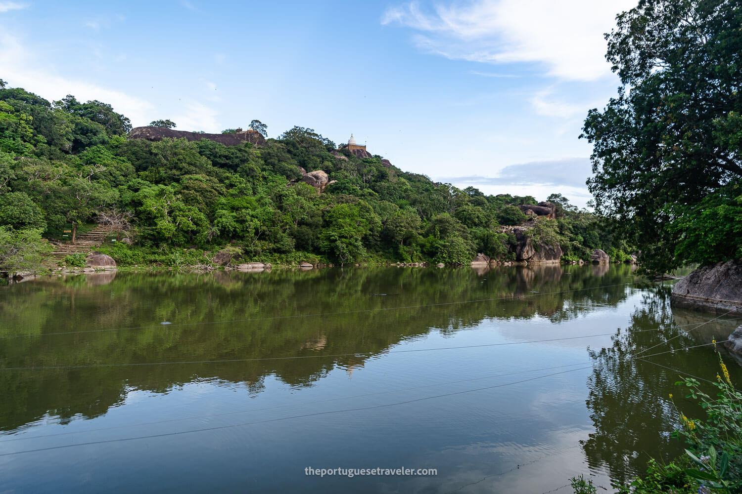 The crocodile lake in between rock formations and temples