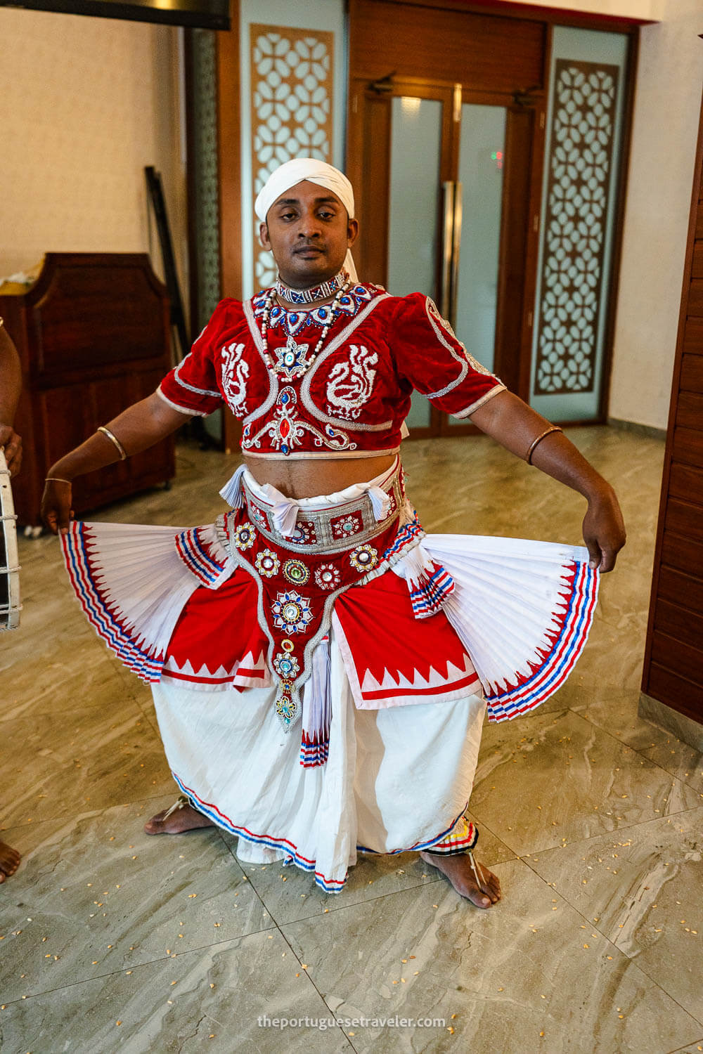 One of the main dancers showing his attire