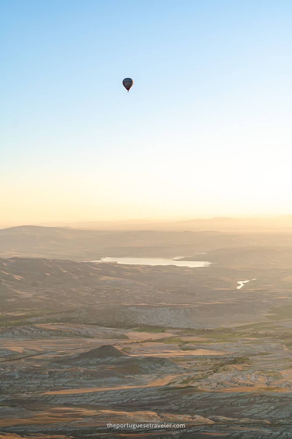 A single balloon in the distance, up high