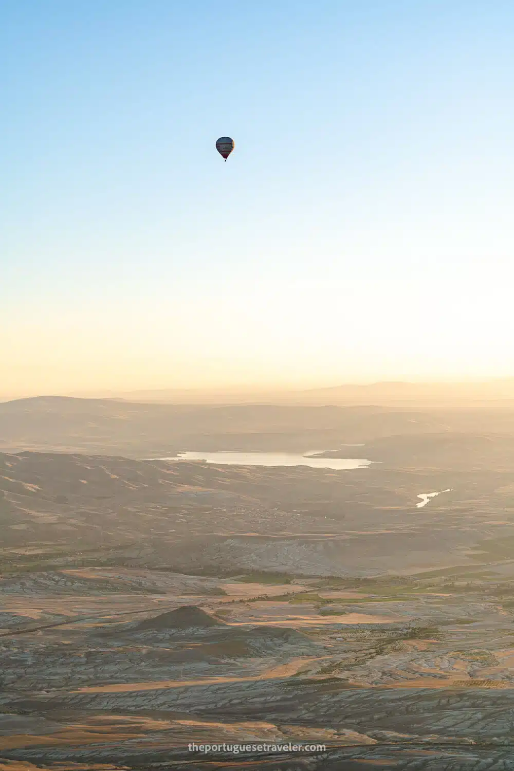 A single balloon in the distance, up high