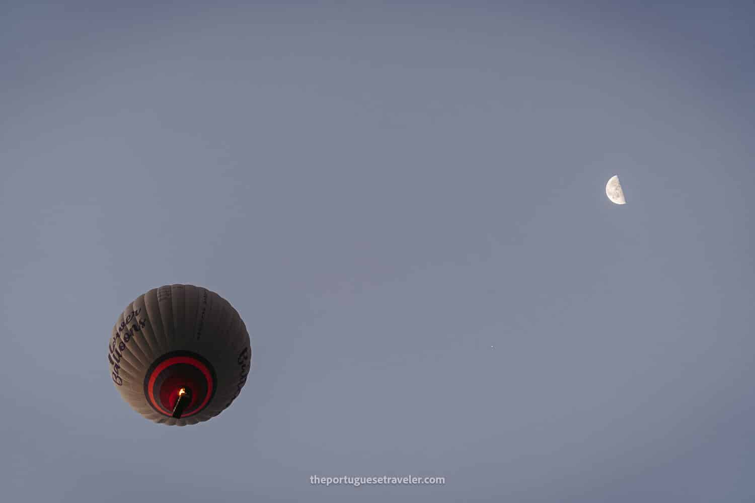 A hot air balloon and the moon in Cappadocia