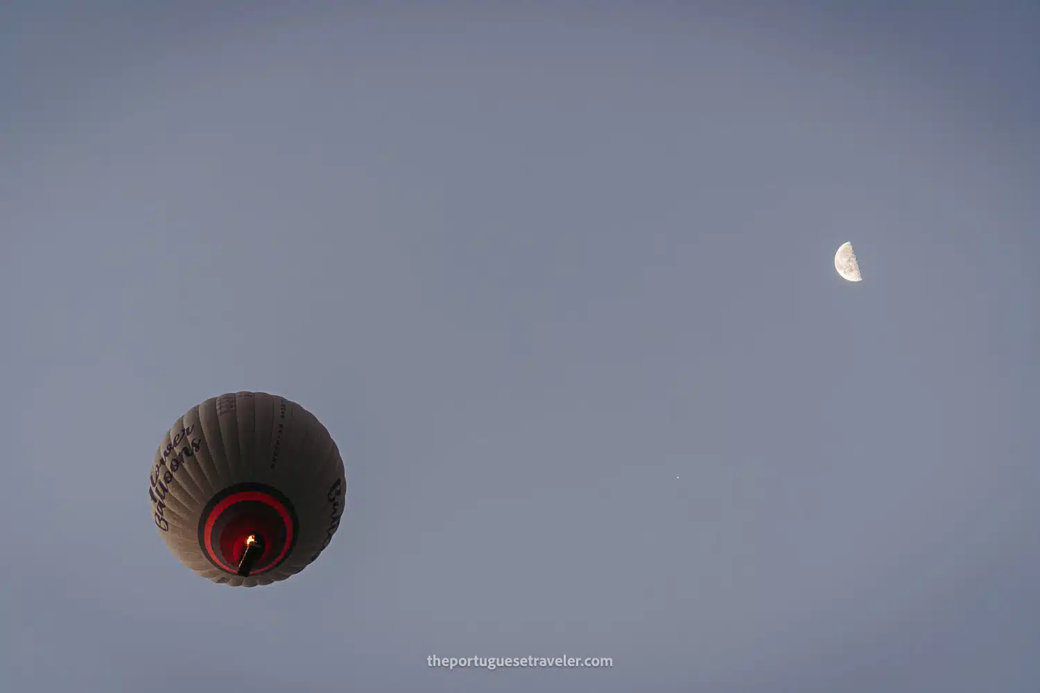 A hot air balloon and the moon in Cappadocia