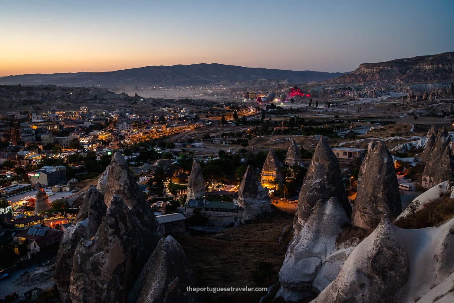 Göreme at dusk with a light show of hot air balloons